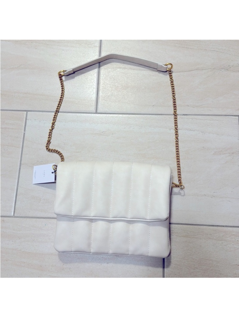 Fawn design the quilted crossbody clutch winter white matte chain strap